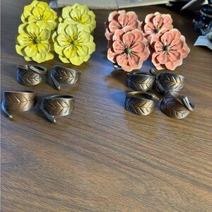 vintage floral napkin holders featuring decorative metal flower attachments.
